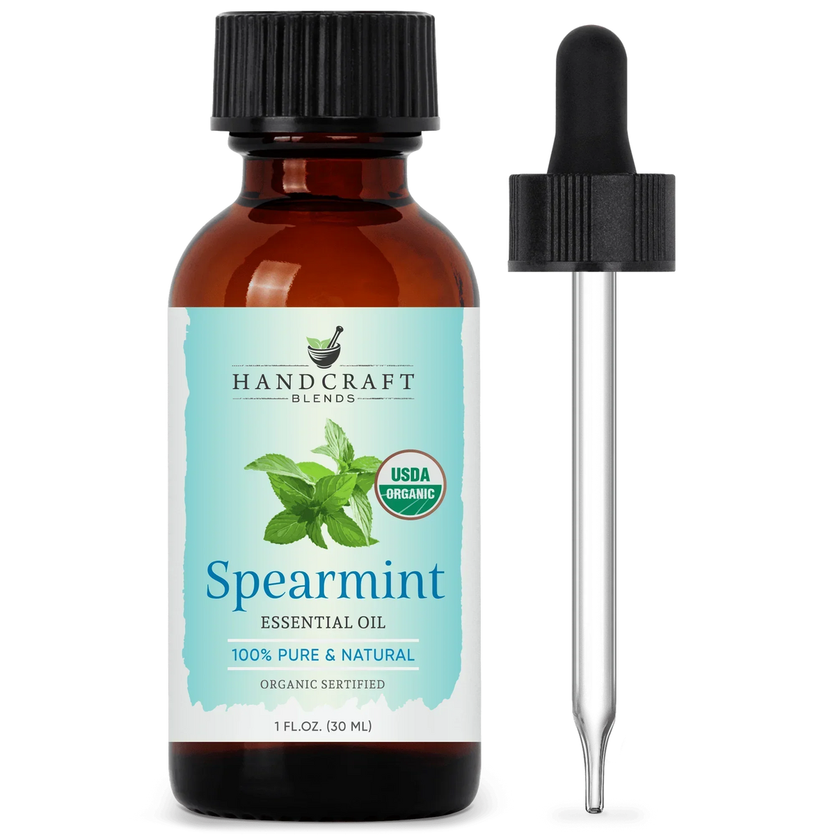 Amber glass bottle of organic spearmint essential oil with dropper, herbal aromatherapy product