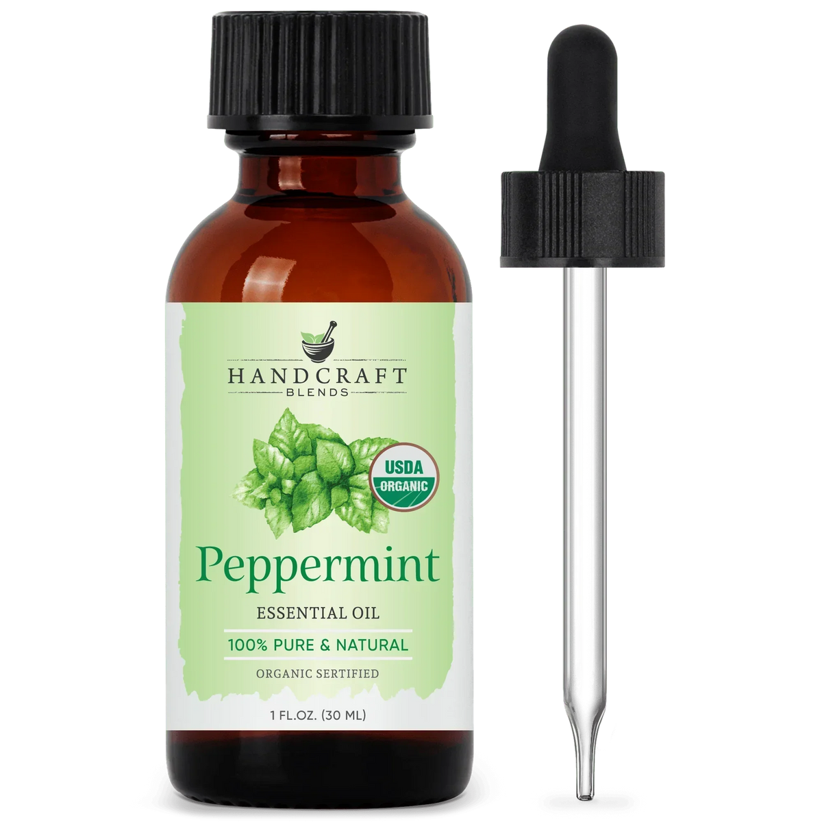 Amber bottle of organic peppermint essential oil with dropper and green mint leaf label
