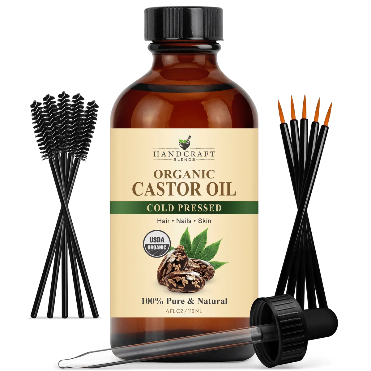Organic castor oil bottle with dropper, spoolie brushes, and cold pressed label