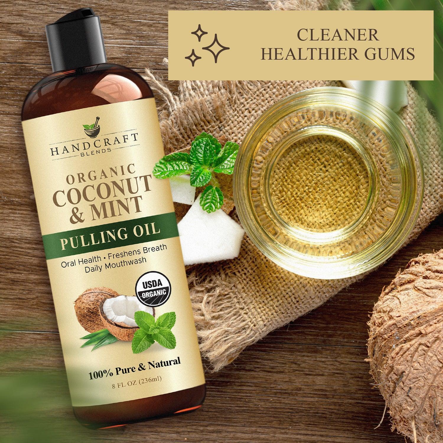 Organic coconut and mint pulling oil bottle with fresh coconut, mint leaves, and a glass bowl of oil on a rustic surface