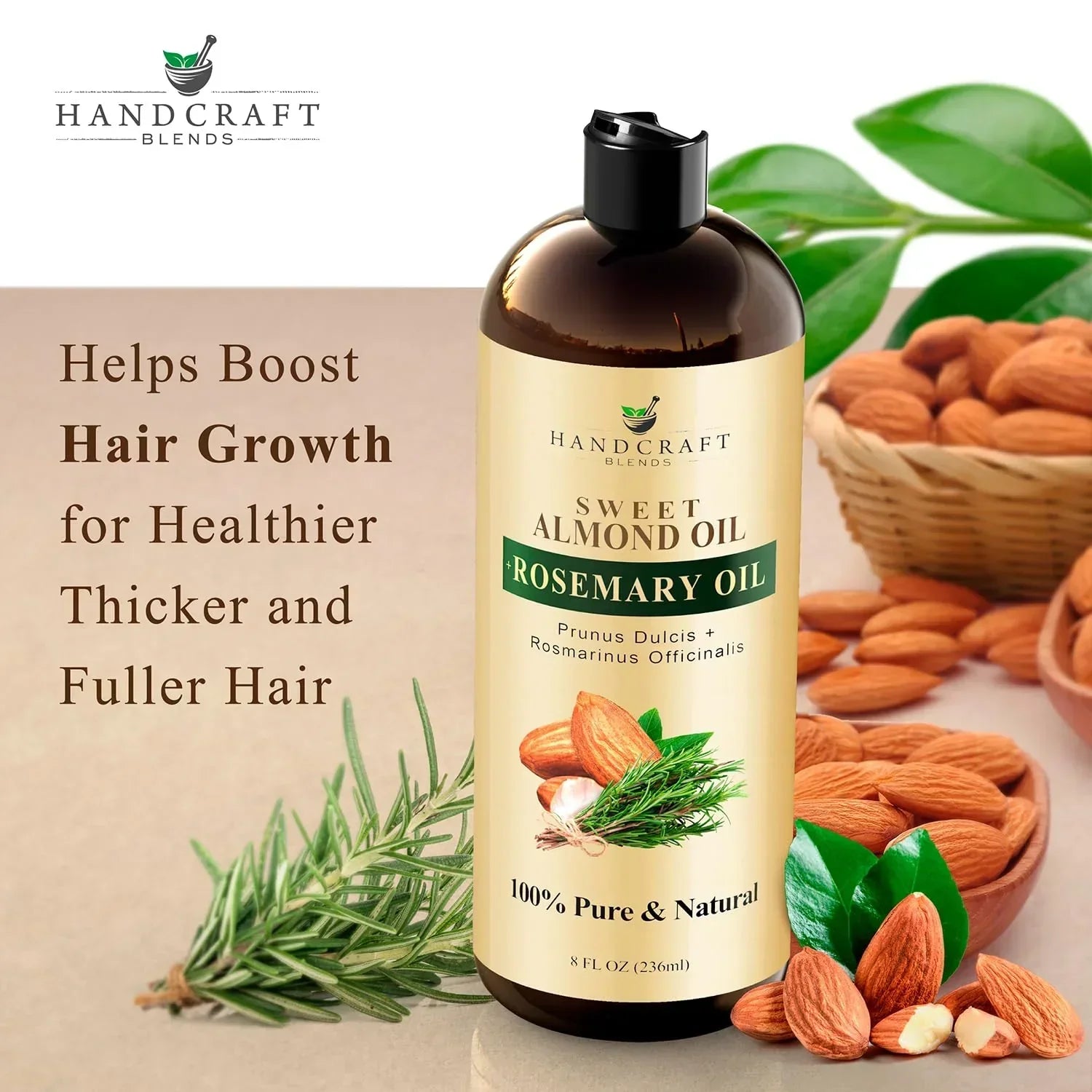 Bottle of sweet almond oil with rosemary oil, almonds, rosemary sprigs, and leaves displayed.