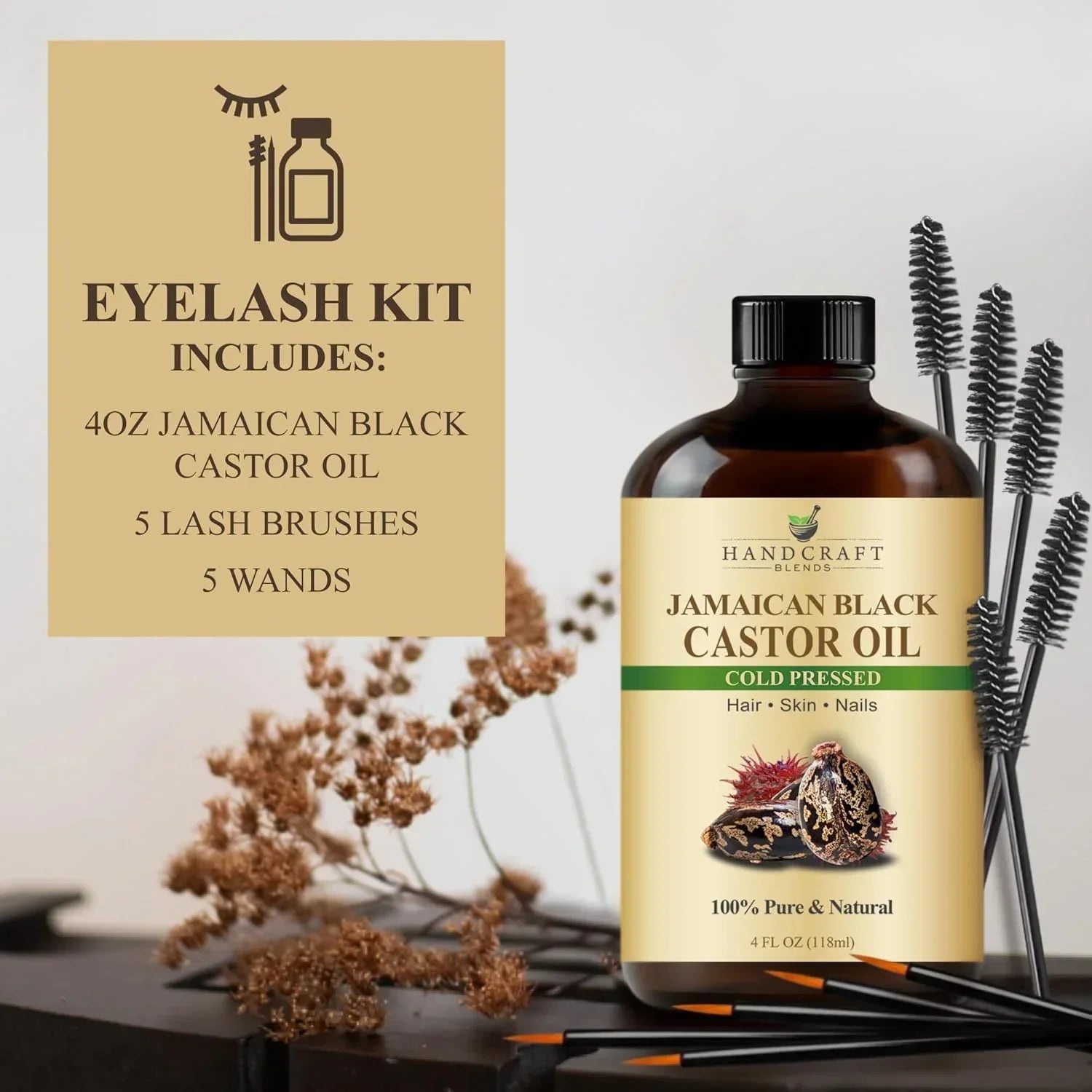 Eyelash kit with Jamaican black castor oil bottle, lash brushes, wands, and dried flowers.