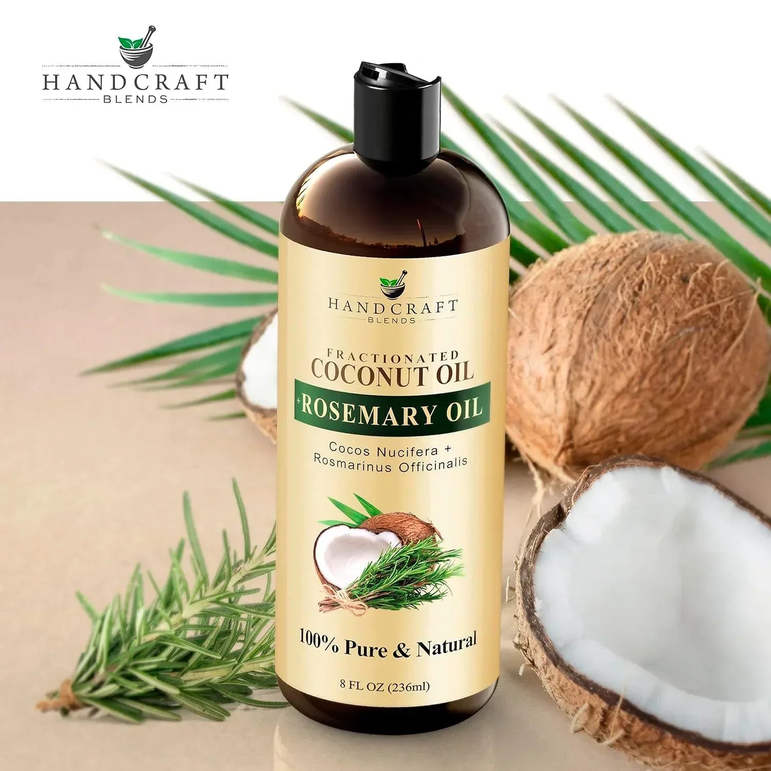 Fractionated coconut oil with rosemary oil bottle, coconuts, and rosemary sprigs