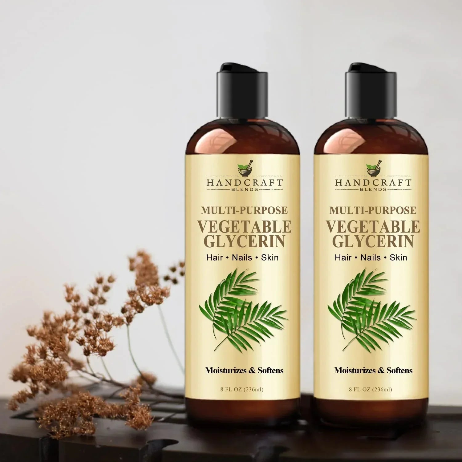 Two bottles of multi-purpose vegetable glycerin for hair, nails, and skin with plant decor