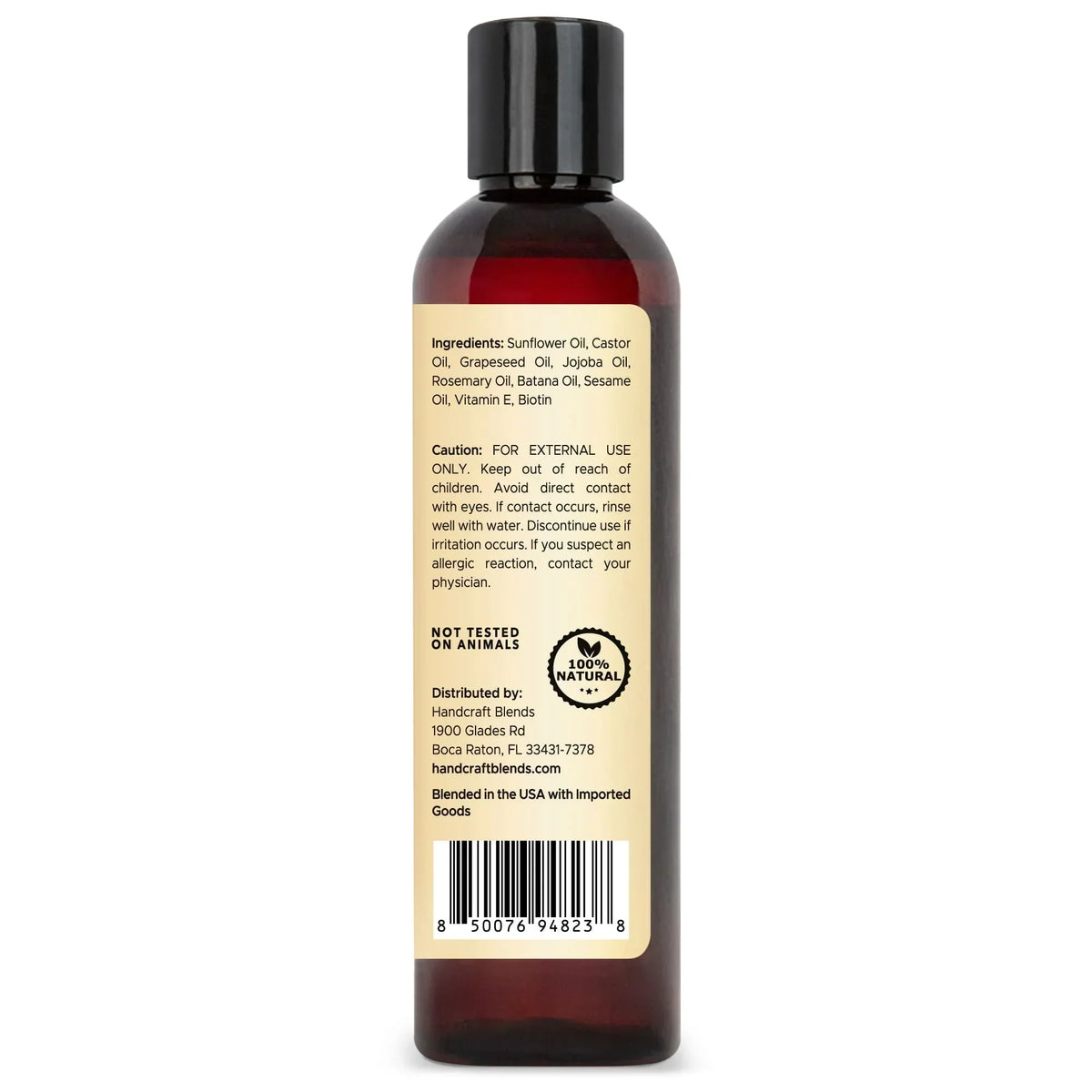 Brown bottle of carrier oil with ingredient list, caution, and 100% natural label on back
