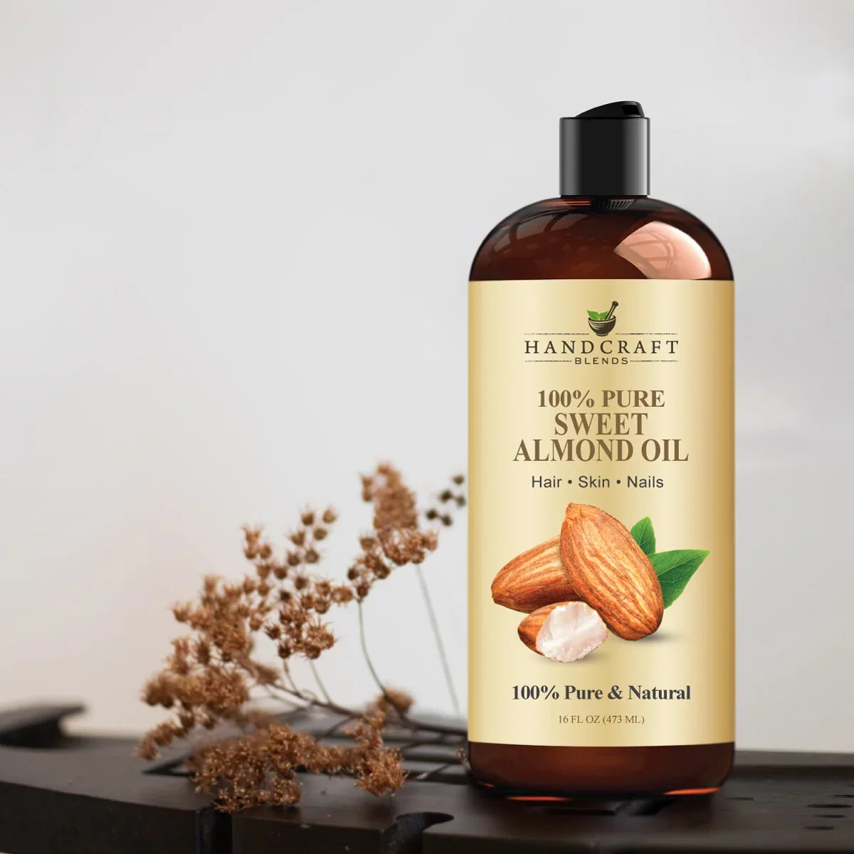 16oz bottle of 100% pure sweet almond oil for hair, skin, and nails with almond illustration