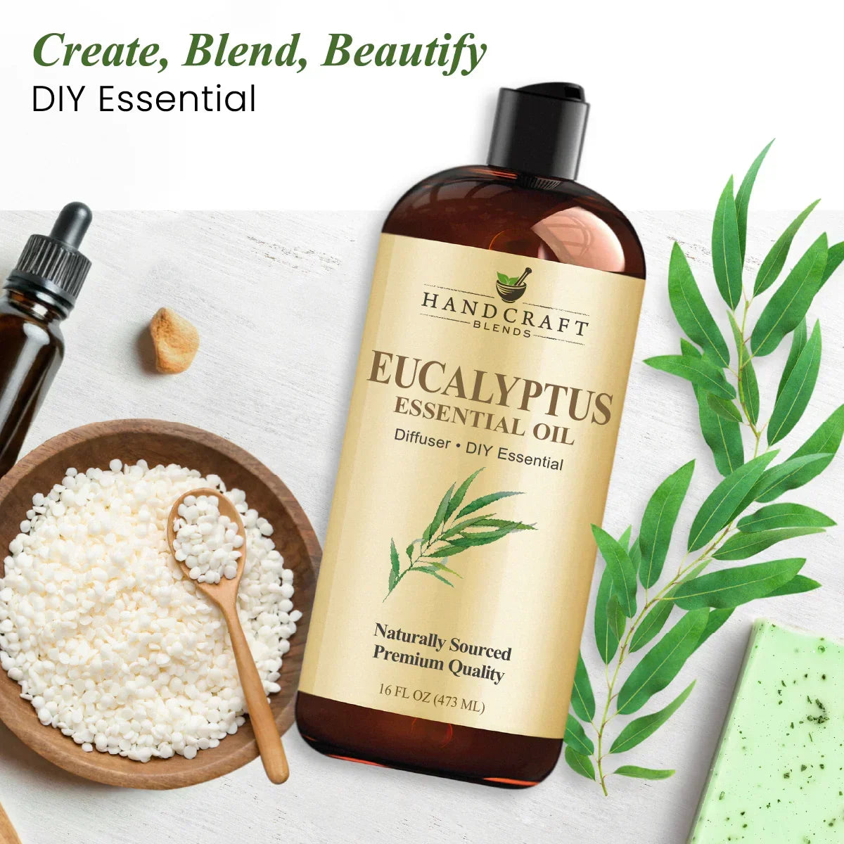 Eucalyptus essential oil bottle with leaves, soap, dropper, and wax beads on white background