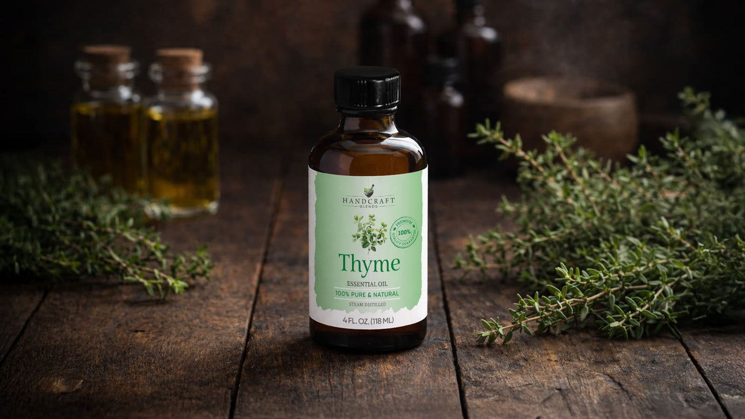 Thyme essential oil bottle with fresh thyme and glass jars on rustic wooden table