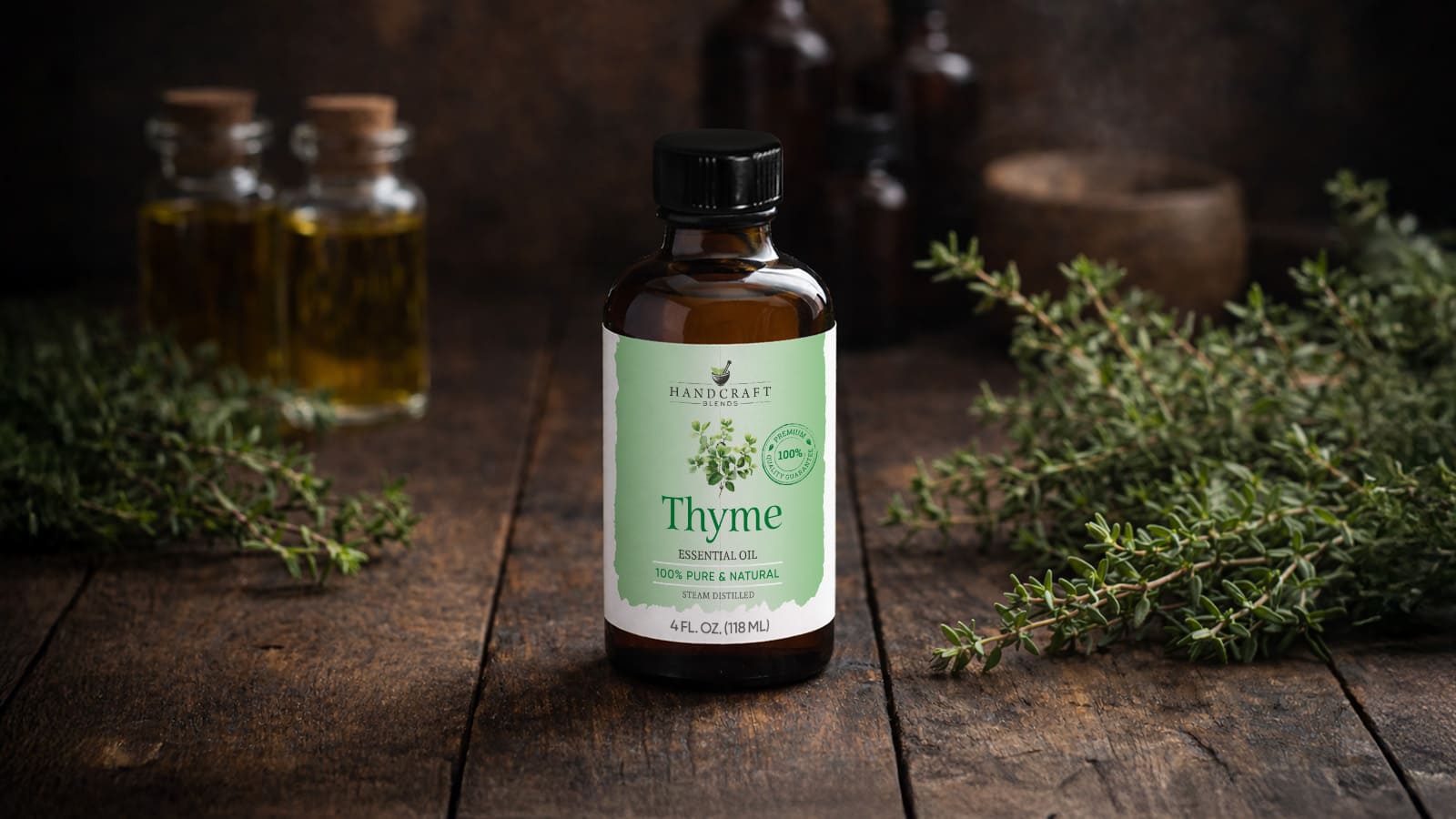 Thyme essential oil bottle with fresh thyme and glass jars on rustic wooden table