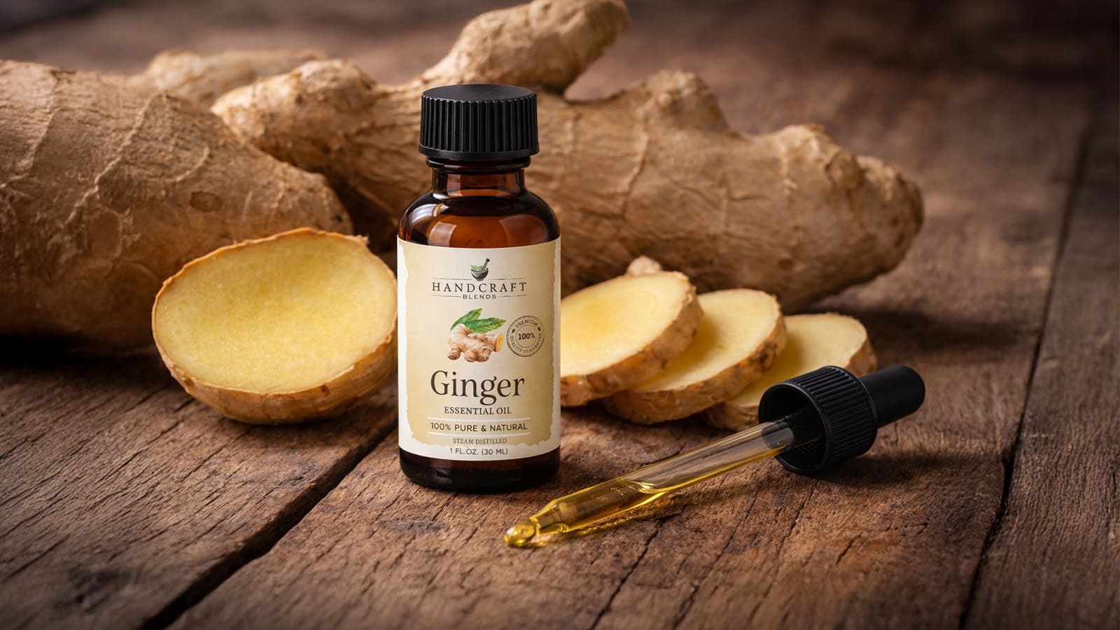 Ginger essential oil bottle with dropper and fresh ginger root on rustic wooden table