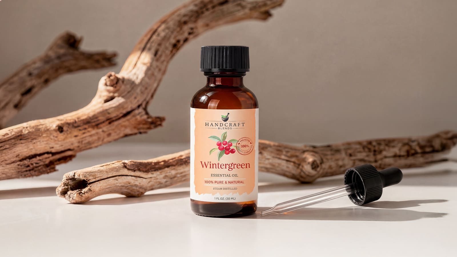 Wintergreen essential oil bottle with dropper, wood background, aromatherapy product
