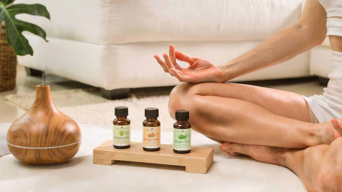 Grapefruit and spearmint essential oil bottles beside a sunny kitchen window
