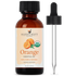 Amber bottle of organic orange essential oil with dropper, labeled pure and natural.