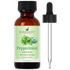 Amber bottle of organic peppermint essential oil with dropper and green mint leaf label