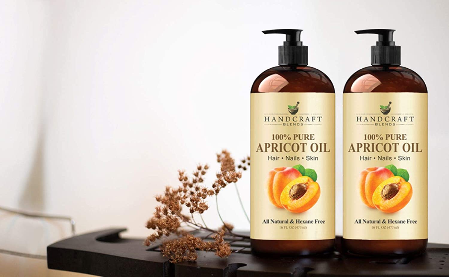 apricot oil 2 bottles with flower